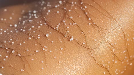 close-up of skin with water droplets and fine hair texture: an intricate study in natural beauty and detail of human skin physiology