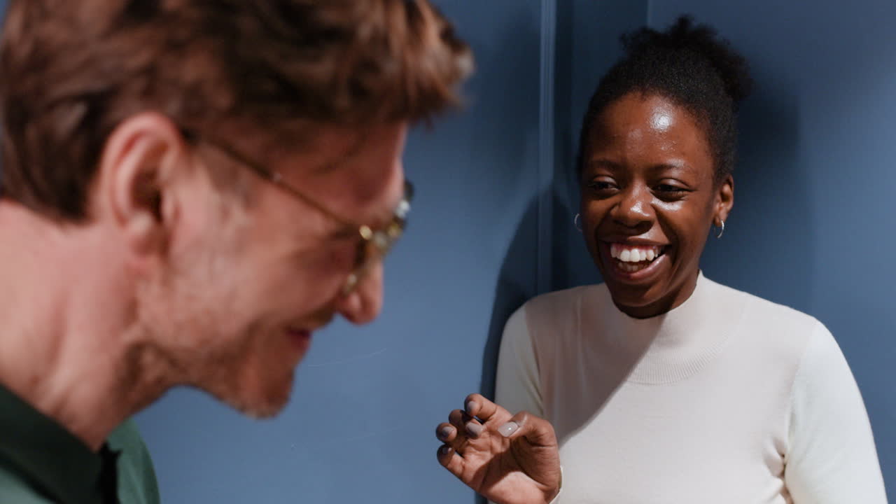 Two people engaged in a friendly conversation