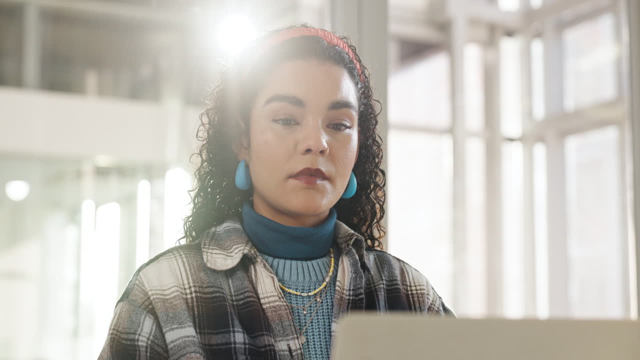Woman with Curly Hair Wearing a Headband Thinking Indoors
