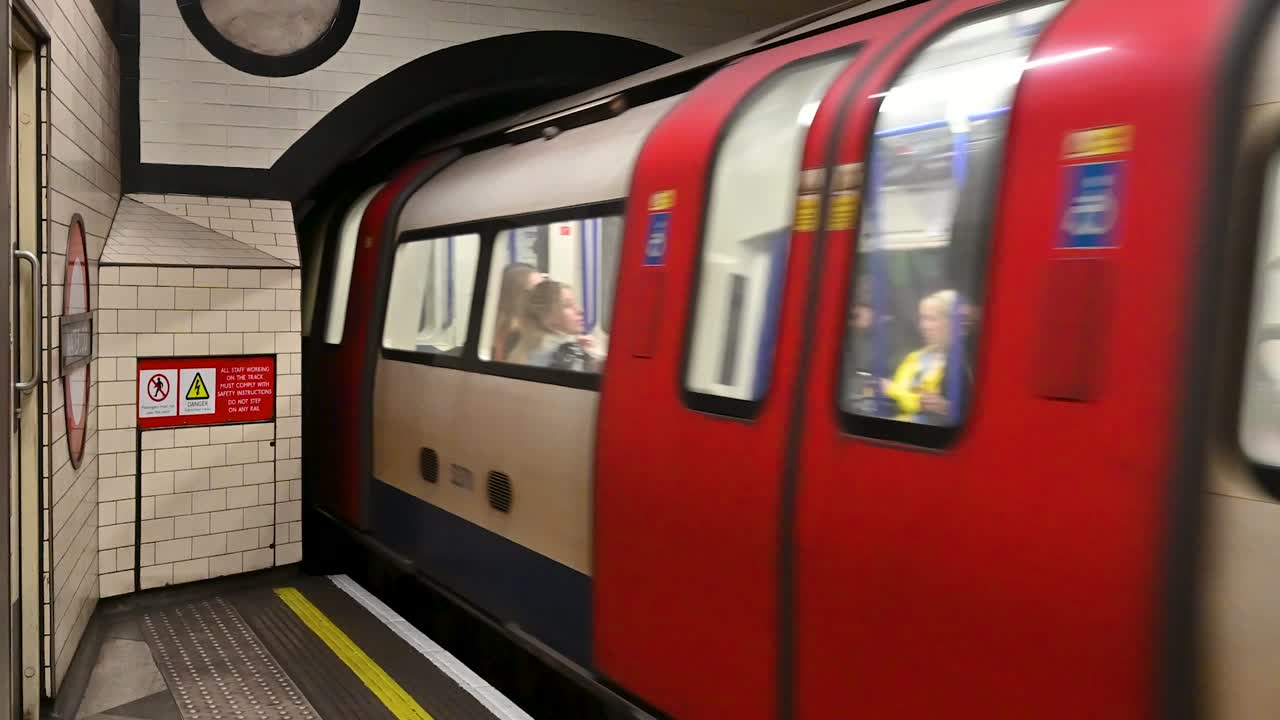 London Underground Train Arriving at Station Platform