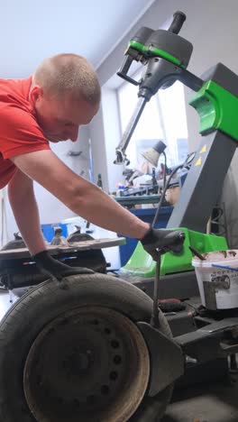 mechanic performing a tire change in an auto repair shop