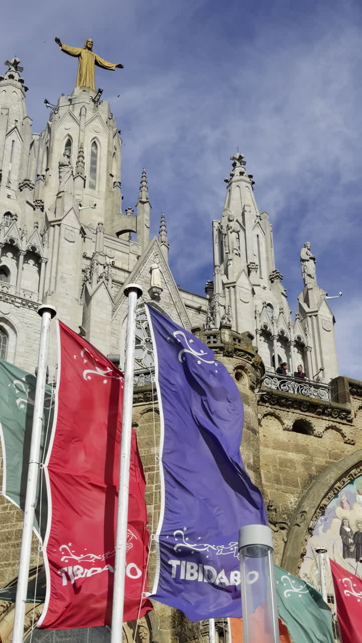 Tibidabo Temple Exterior View with Flags and Statue