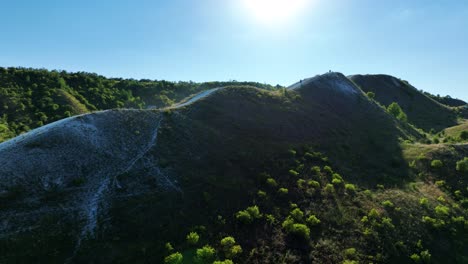 scenic hillside with hikers