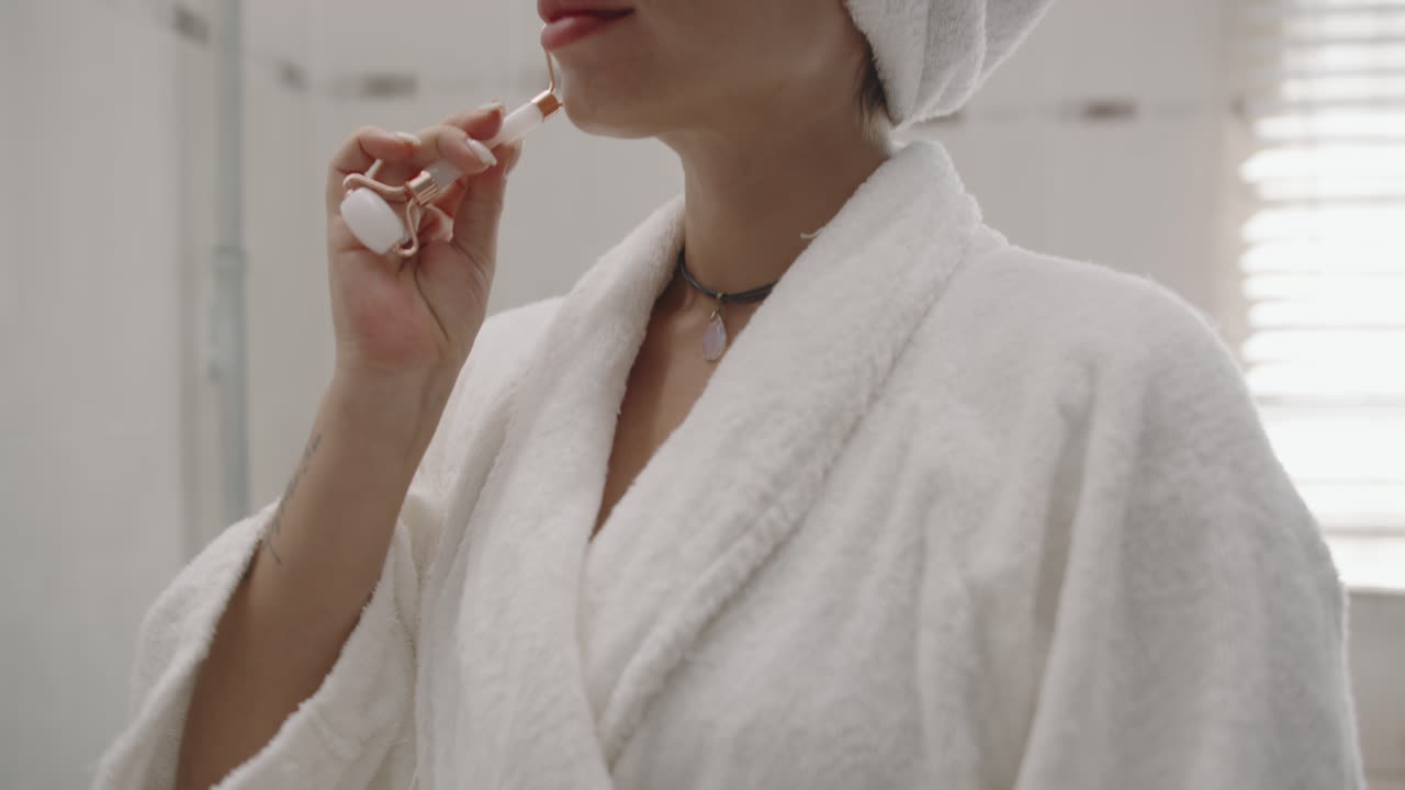 Woman Practicing Facial Massage with Roller