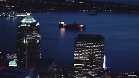 american flag waving on city building aerial