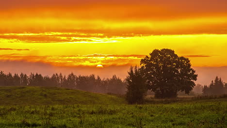 aerial time lapse of mystic golden sunrise behind