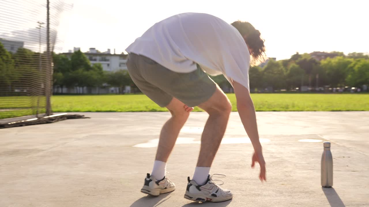 Man Stretching Outdoors in Park