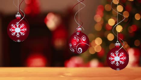 Animation-of-christmas-baubbles-over-bokeh-garlands