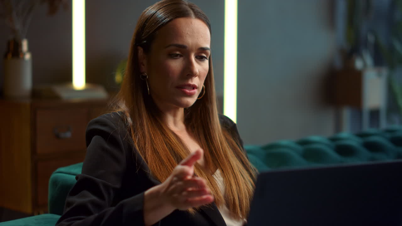 Businesswoman having video chat on laptop indoors