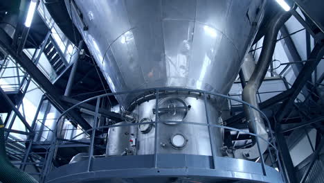 large milk processing plant. modern metal equipment inside the factory for production of dairy products. dairy food production plant.