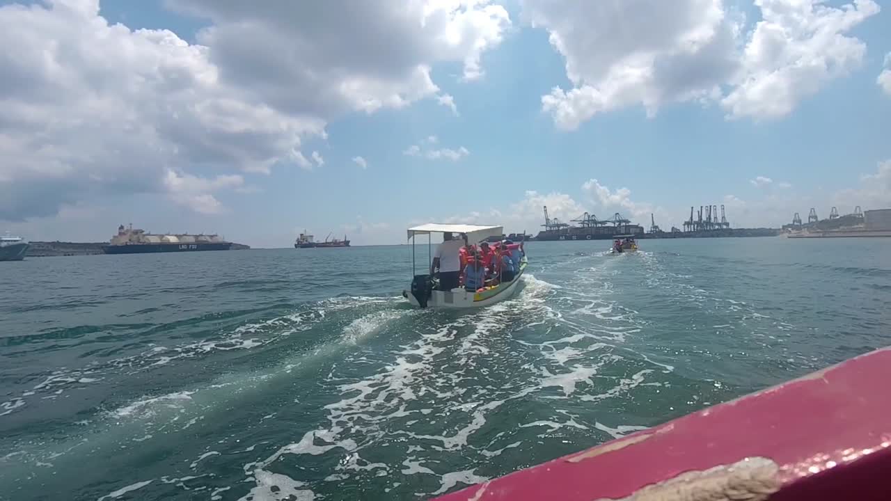 Boat trip near a busy port