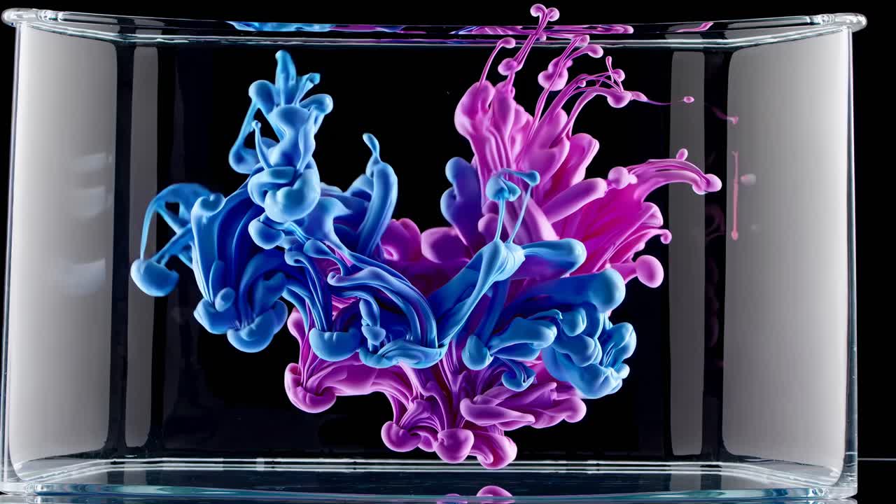 Abstract Ink Colors in Glass Container