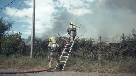 firefighters in action on a farm in flames in chile