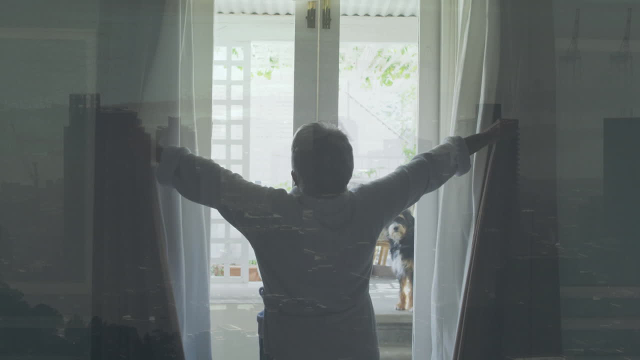 Opening curtains, person revealing bright outdoor patio with dog in background