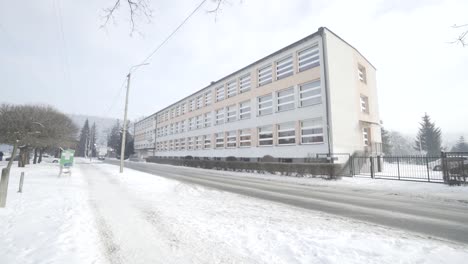 a public high school building in winter scenery