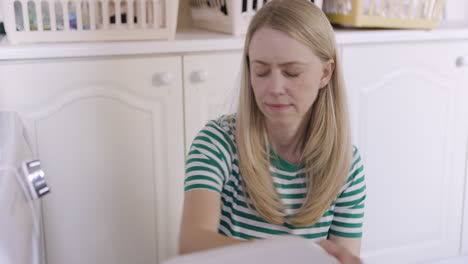 woman doing laundry in laundry room