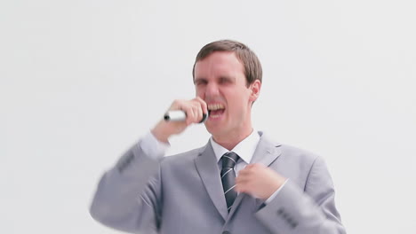 businessman singing into a cordless microphone