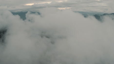 aerial drone flying high over the clouds