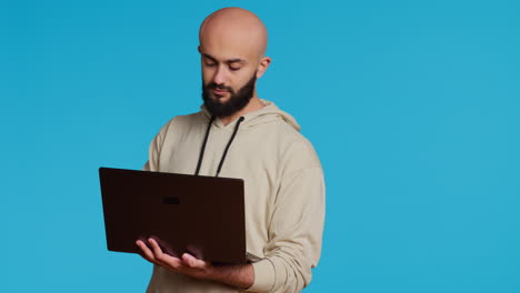 Middle-eastern-man-works-with-cyber-security-on-laptop