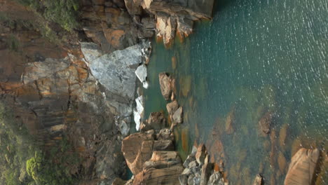 vertical view from drone flying low over yaté river, next to yaté dam, grande terre, new caledonia