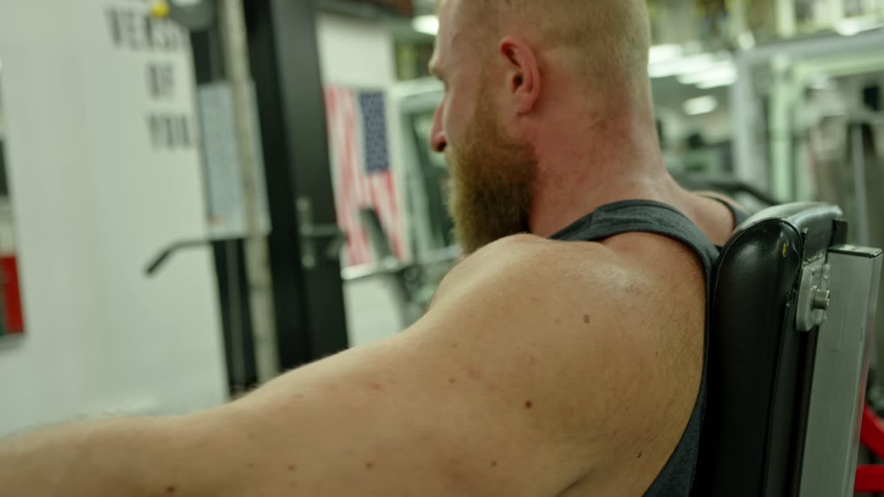 Muscular bodybuilder handsome men doing exercises in gym