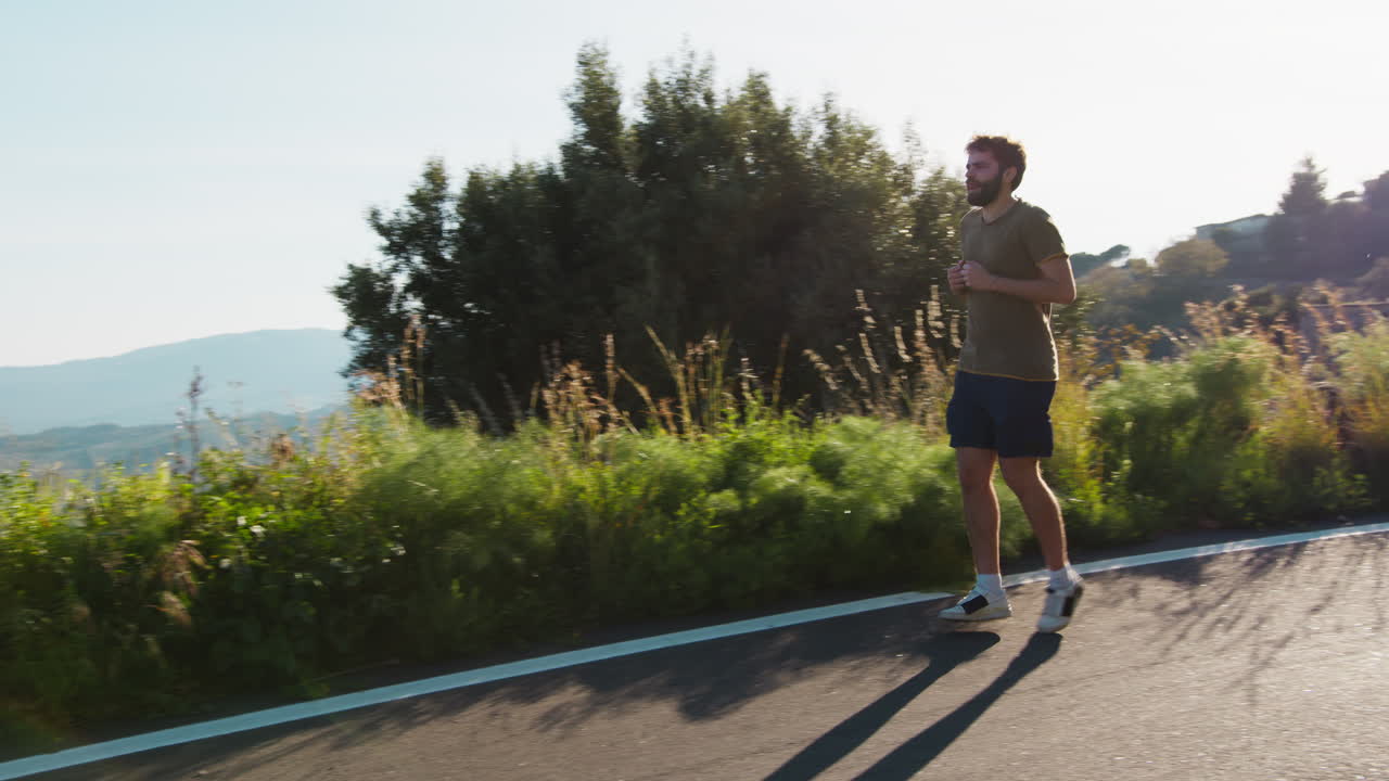 Man running on scenic mountain road