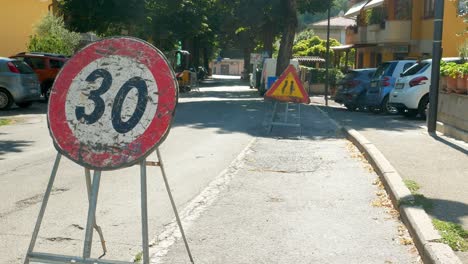 A-temporary-speed-limit-sign-set-up-on-the-residential-street-in-Chianti,-Tuscany