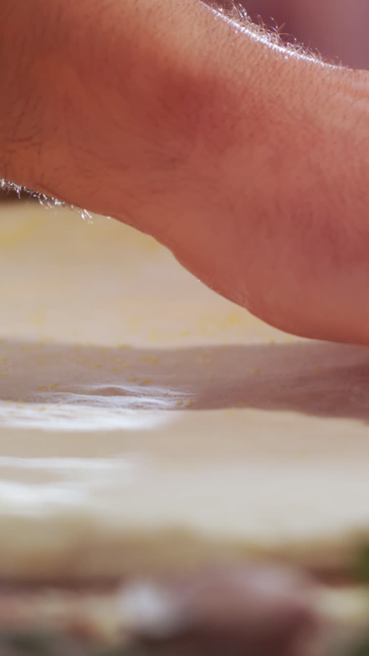 Hands preparing dough