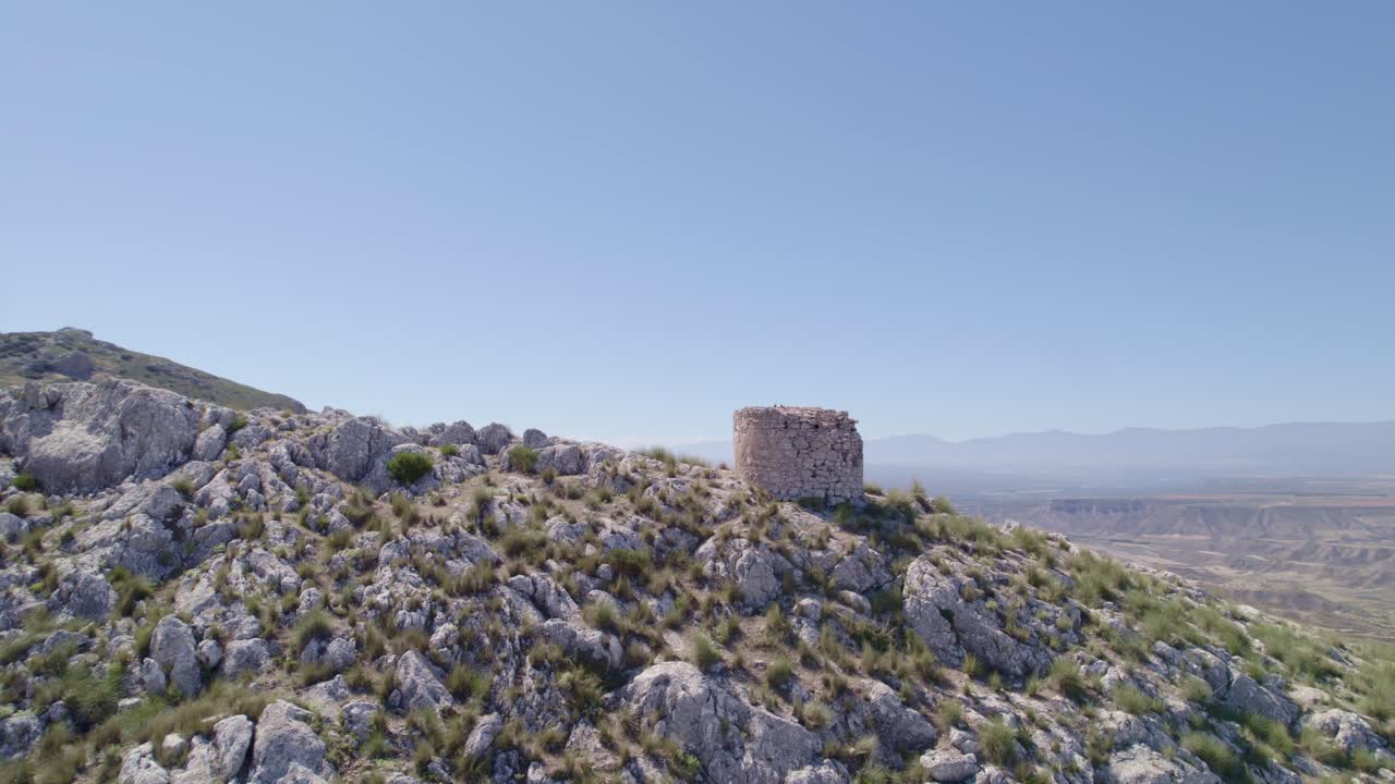 Medieval watchtower. Ruins of a medieval watchtower on a mountain cliff. Aerial tracking shot. Pedro Martinez. Spain