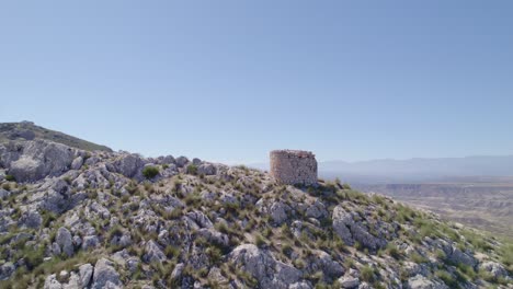 medieval watchtower. ruins of a medieval watchtower on a mountain cliff. aerial tracking shot. pedro martinez. spain