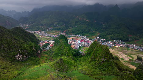 dong van, vietnam with majestic mountainous landscape and valleys at sunset. aerial forward