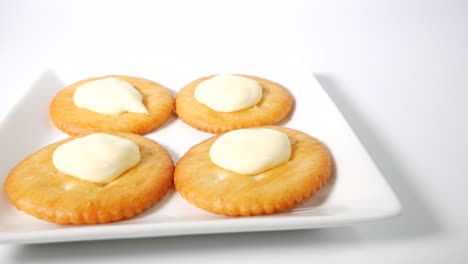 round crackers with mayonnaise