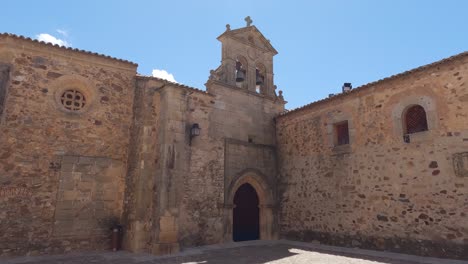 Medieval-bell-tower-of-church-Convento-in-Caceres,-Spain,-establishing-shot