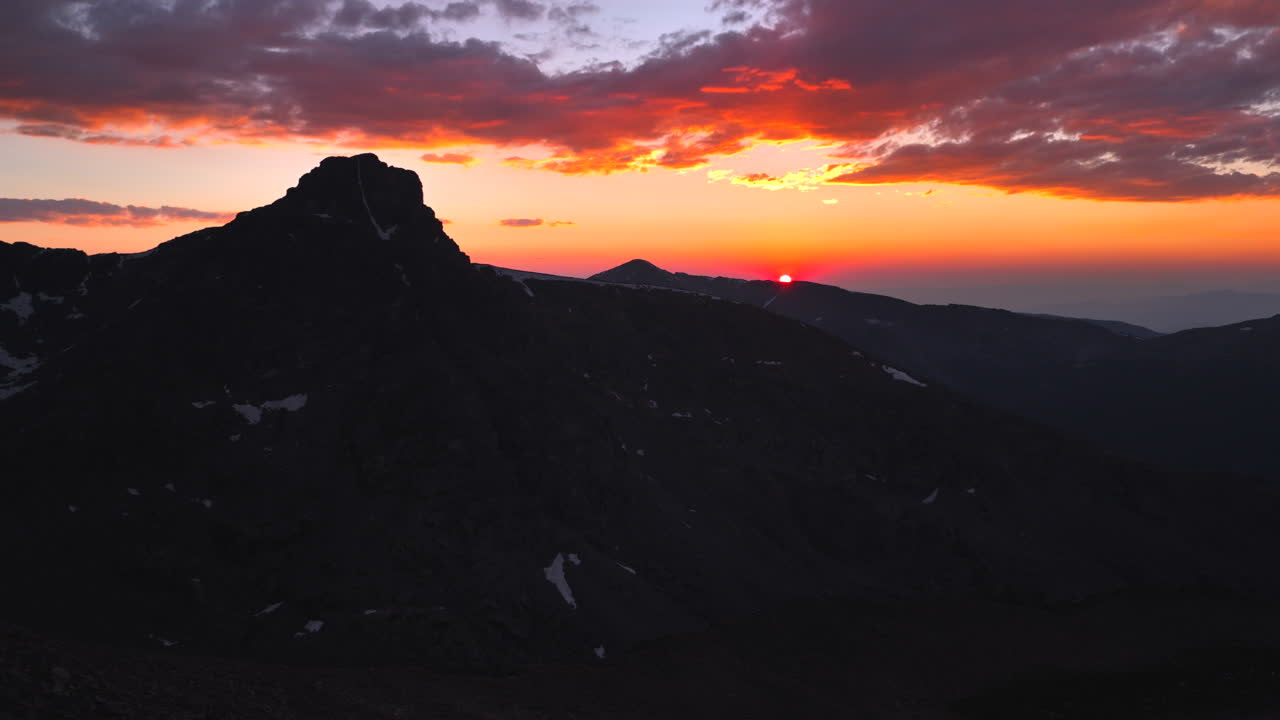 Mount of the Holy Cross Colorado 14er peak Sawatch Range aerial drone Vail Minturn Halo Ridge golden hour vibrant sunset on Rocky Mountains horizon Notch Mountain shelter circle left motion