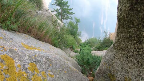 View-of-the-peaks-covered-in-fog-as-seen-from-the-trail-to-the-North-Peak-summit-of-the-inspiring,-sacred-and-majestic-Huashan-mountain,-famous-tourist-attraction,-Shaanxi-province,-China