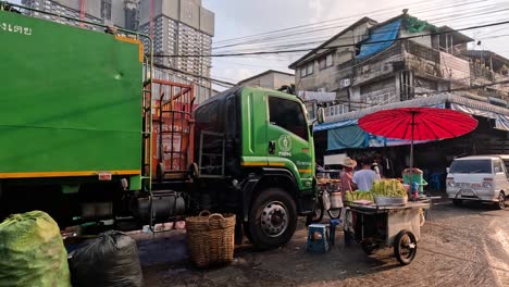 workers loading trash onto a garbage truck