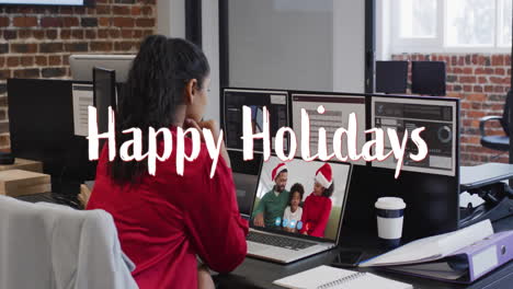 Animation-of-happy-holidays-text-over-african-american-family-on-laptop-screen-at-christmas