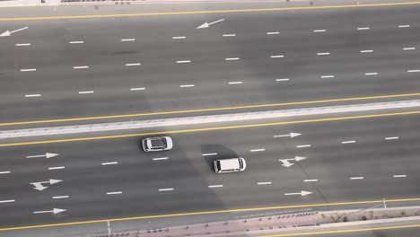 cars and motorbikes on a busy dubai road