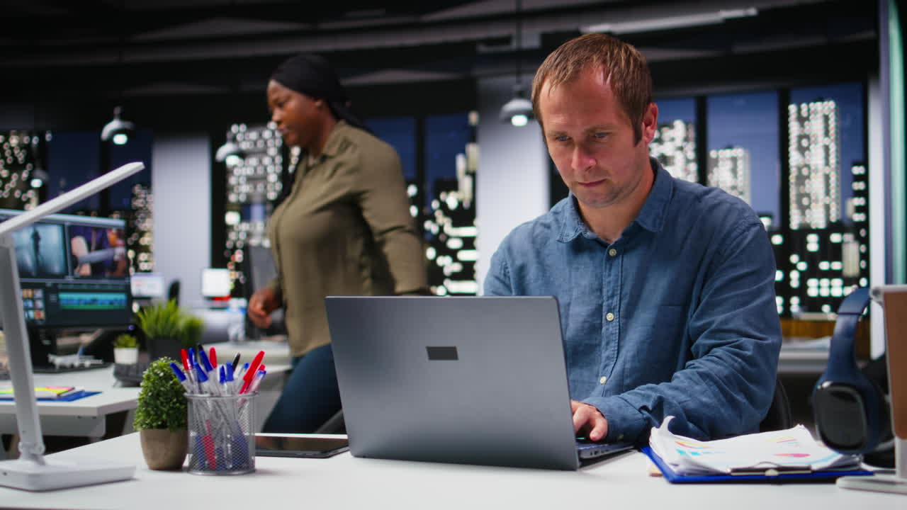 Focused businessman using computer to analyze insights and performance metrics