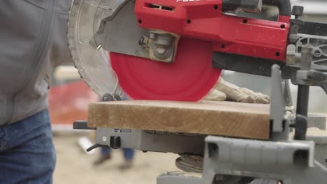 slow motion, circular saw suddenly stopping after safety mechanism trigger in a factory workshop