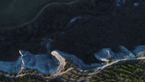 aerial view of a valley with river and rock formations