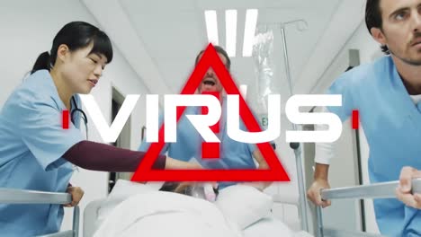 Attention-sign-with-Virus-text-against-doctors-wheeling-a-bed-in-hospital