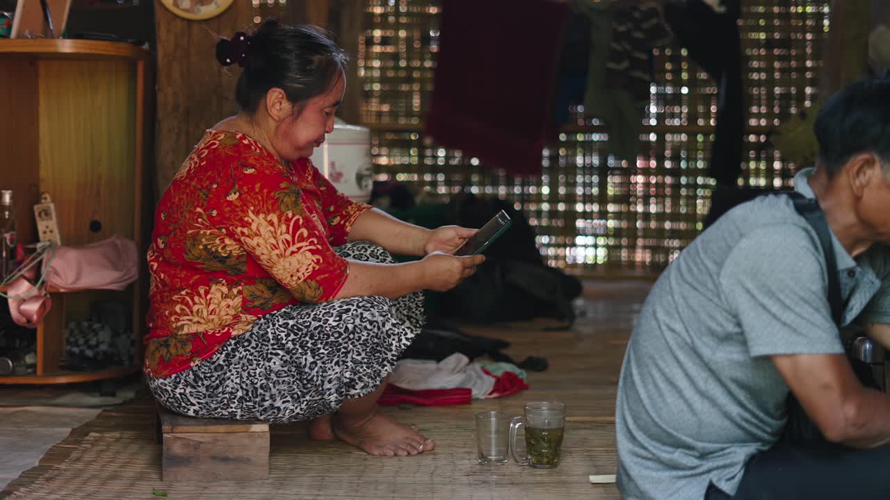 People sitting and using a cell phone