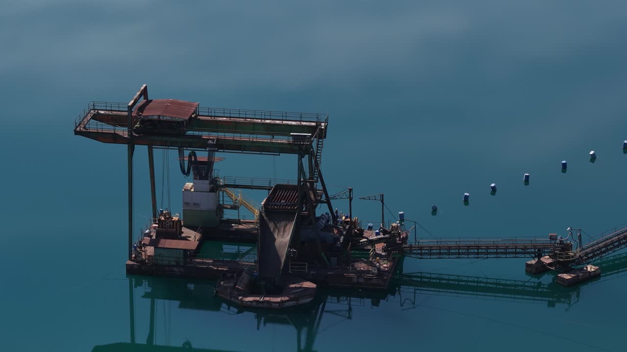 Sand mining in Northern Italy – sand depot, construction materials, extraction from a lake, aerial view