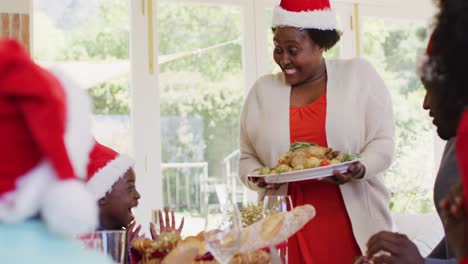 african american family wearing santa hats