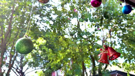 decorative bells and ornaments hanging from trees