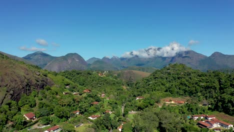 slow aerial pan of petrópolis, rio de janeiro and surrounding mountains views.
