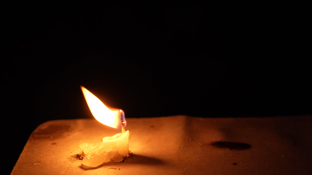 A candle flame is burning