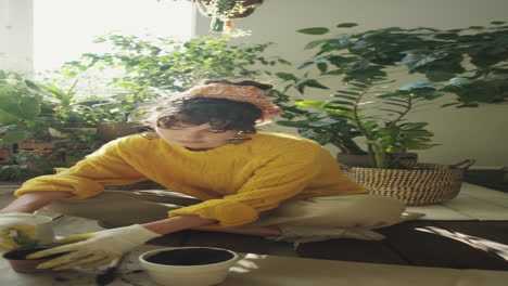 girl repotting houseplant