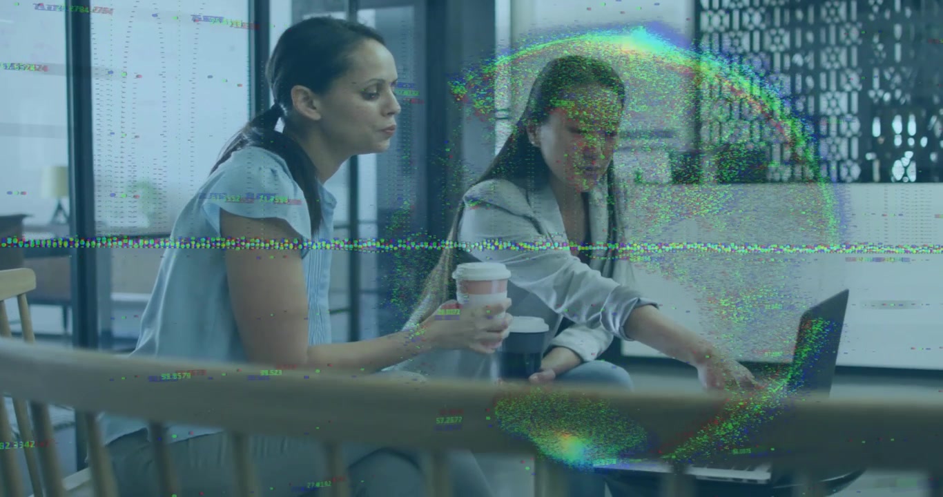 Two colleagues touching trackpad with coffee while viewing animated chart on laptop for business